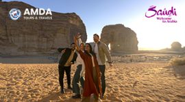 A group of friends in Western dress capturing a selfie together near Elephant Rock
